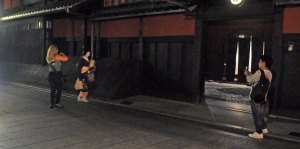 I would just like to point out how NOT to photograph maiko and geiko. Here is poor Sayaka having her personal space totally invaded by a woman. Meanwhile the woman's partner waits right at the entrance to Ichiriki, where Sayaka will enter, to accost her again. This is terrible behaviour by tourists.